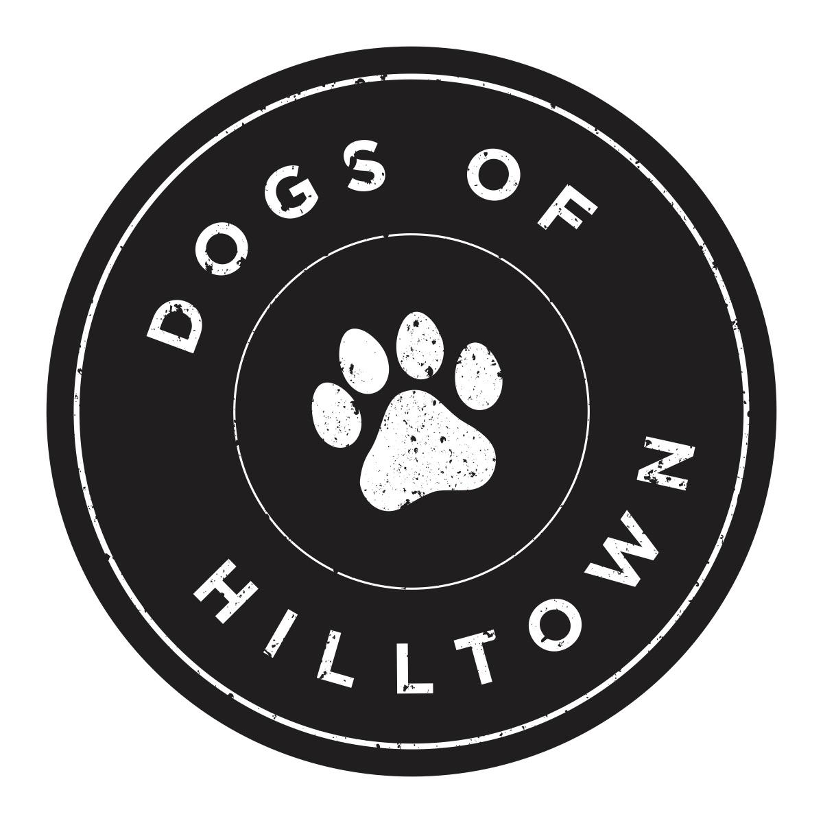 Dogs of Hilltown Logo - It is a black circle. In the middle is a white paw print. On the outside of the paw print it says Dogs of Hilltown in a white font. 